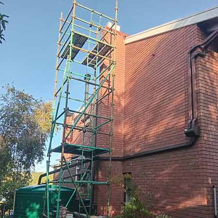 Defensive established bee colony in roof cavity wall in Welgemoed.